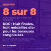 Gradins bleus et tableau d'affichage du gymnase jumelé du stade des Martyrs à Kinshasa, où se disputent les finales du championnat d'Afrique de boxe